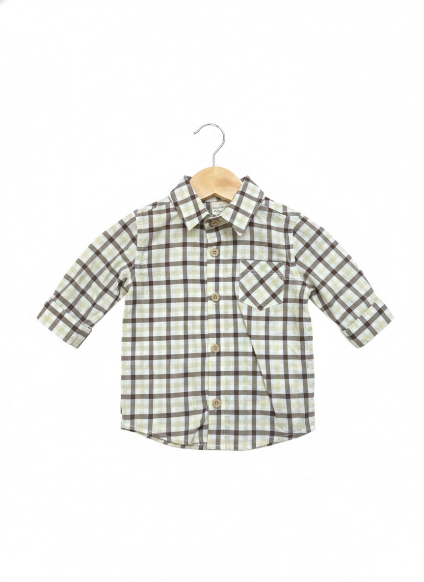 Classic baby boy holiday outfit with green knit vest and denim pants