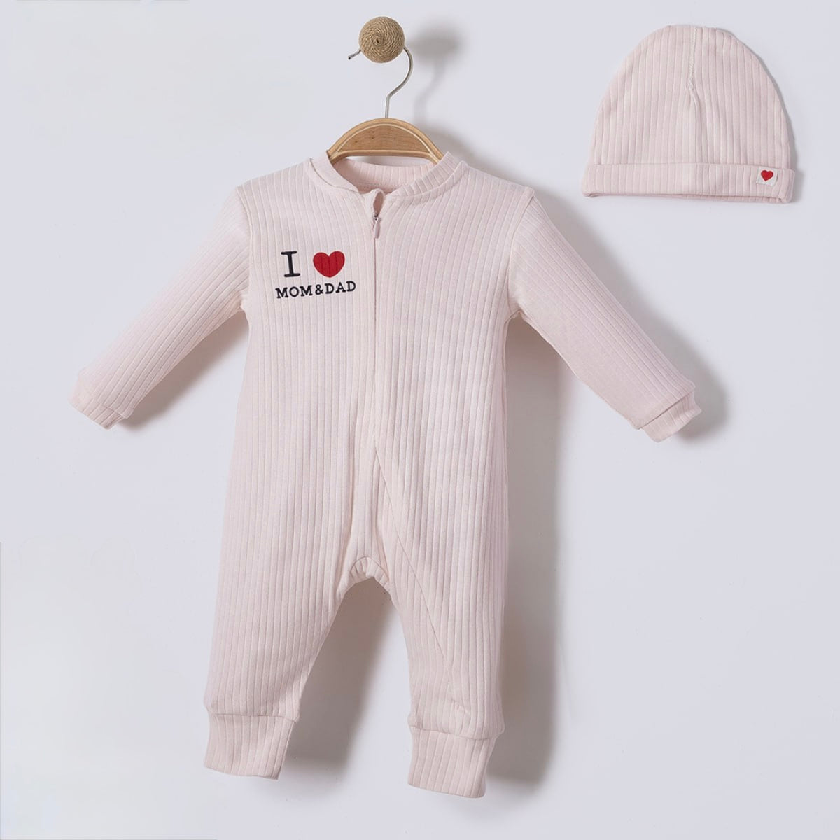 Newborn zip romper with matching hat in neutral tone