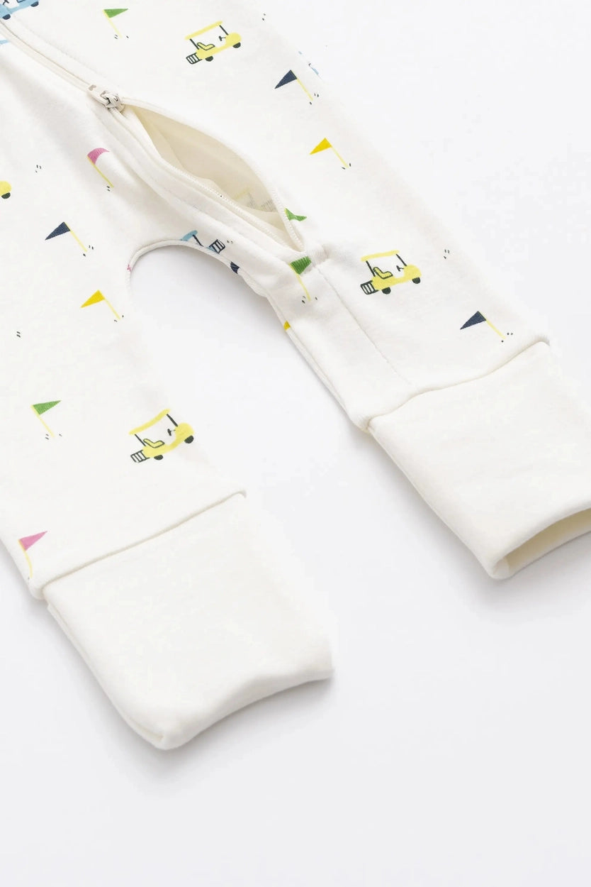 Cozy baby cotton pajamas with golf cart pattern, fold-over cuffs, and full-length zipper.