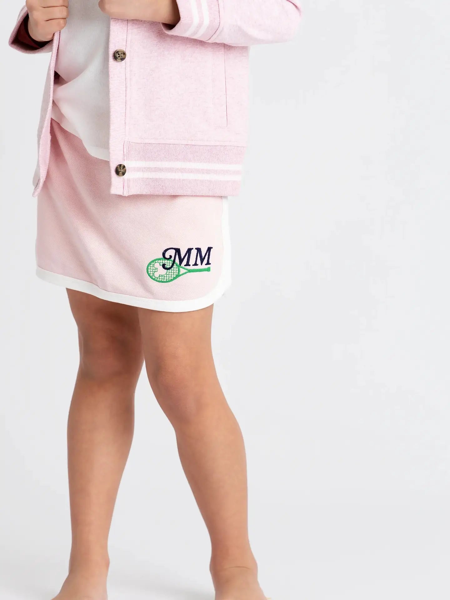 Girls pink athletic tennis skort featuring Disney Minnie Mouse sports-inspired embroidery.