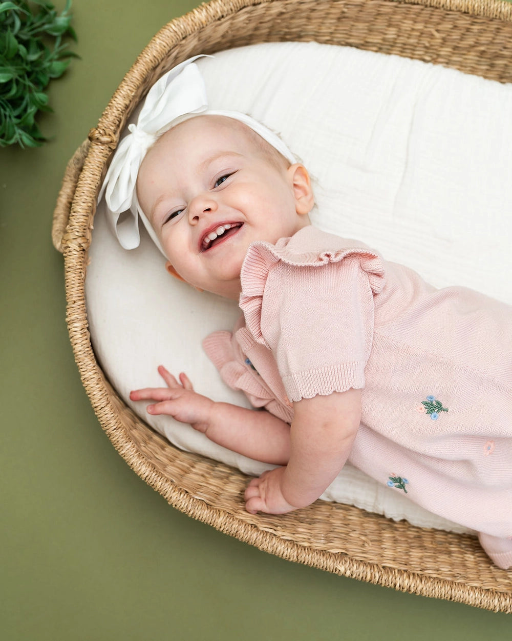 organic cotton floral baby dress with short ruffle sleeves and delicate wavy trim