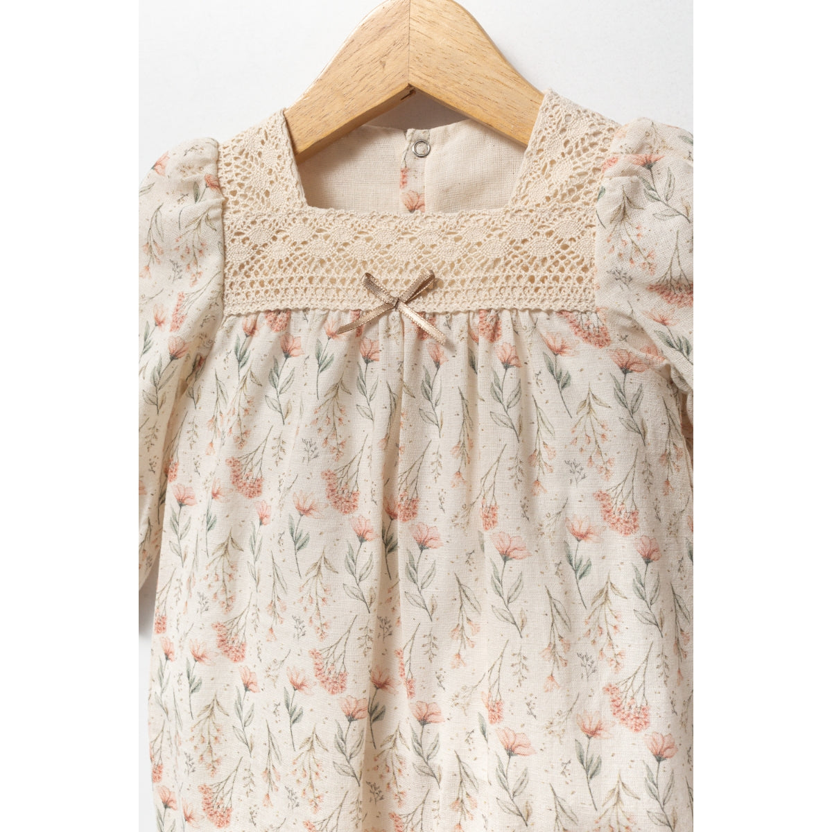 Floral baby romper with lace yoke and puff sleeves