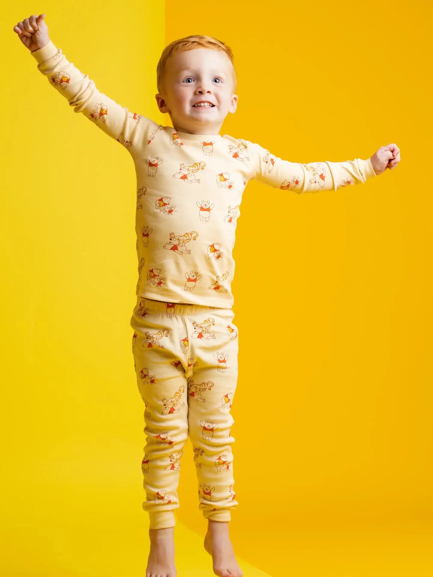 Soft Disney Winnie the Pooh sleepwear set for toddlers and kids with matching long sleeve top and pants.