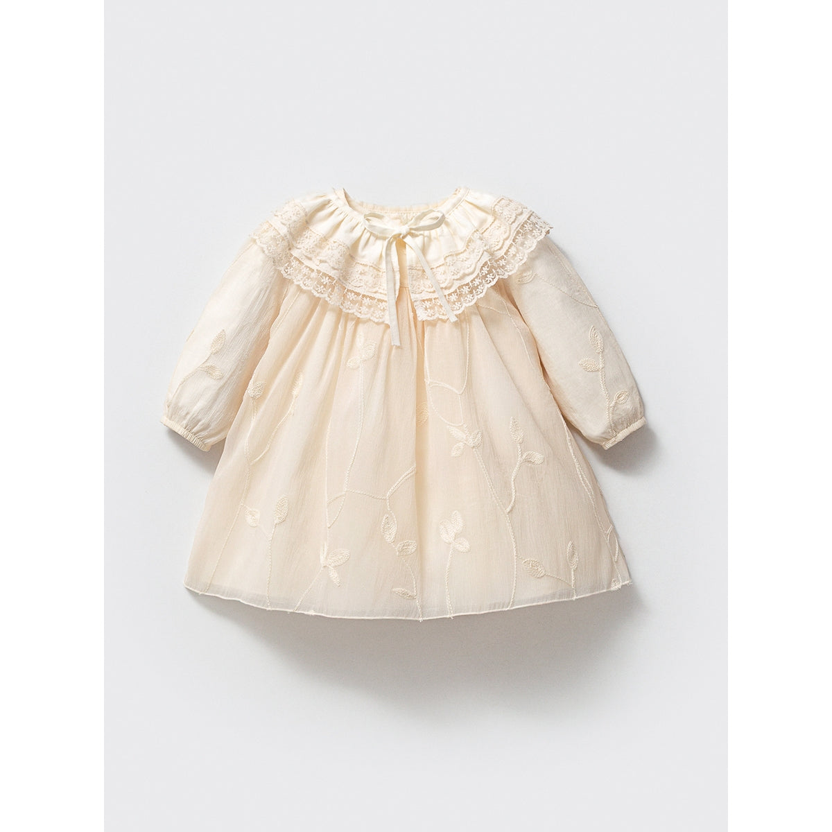 Cream baby dress with lace ruffle collar and floral embroidery, long sleeves.