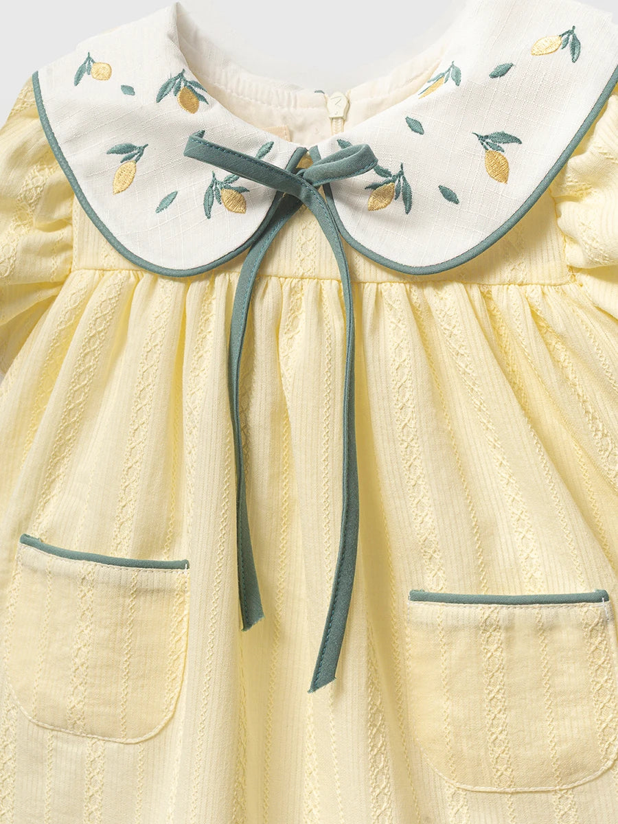 Light yellow baby dress with lemon embroidery detail