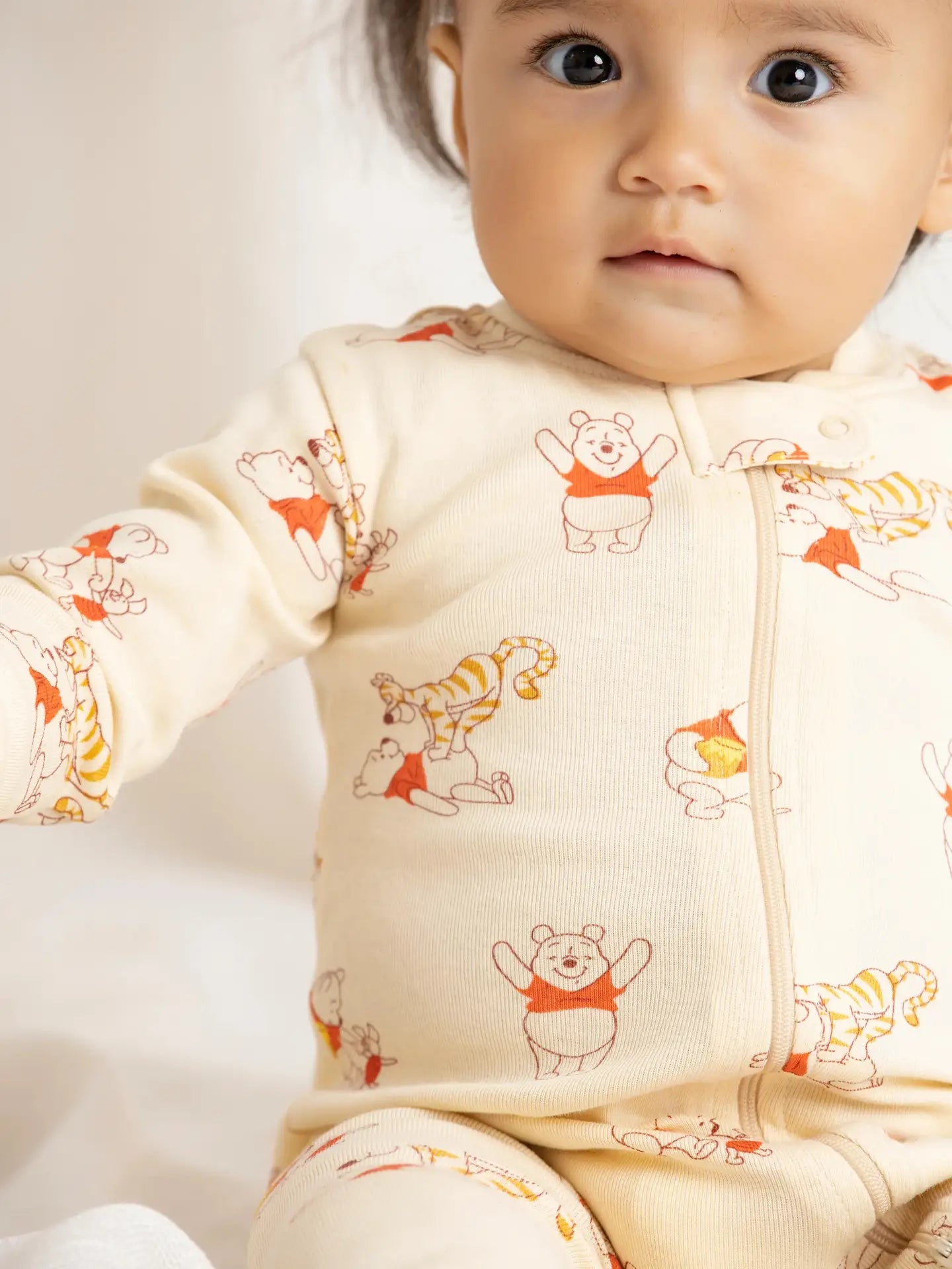 Soft organic cotton baby sleeper featuring Winnie the Pooh and Tigger all-over print