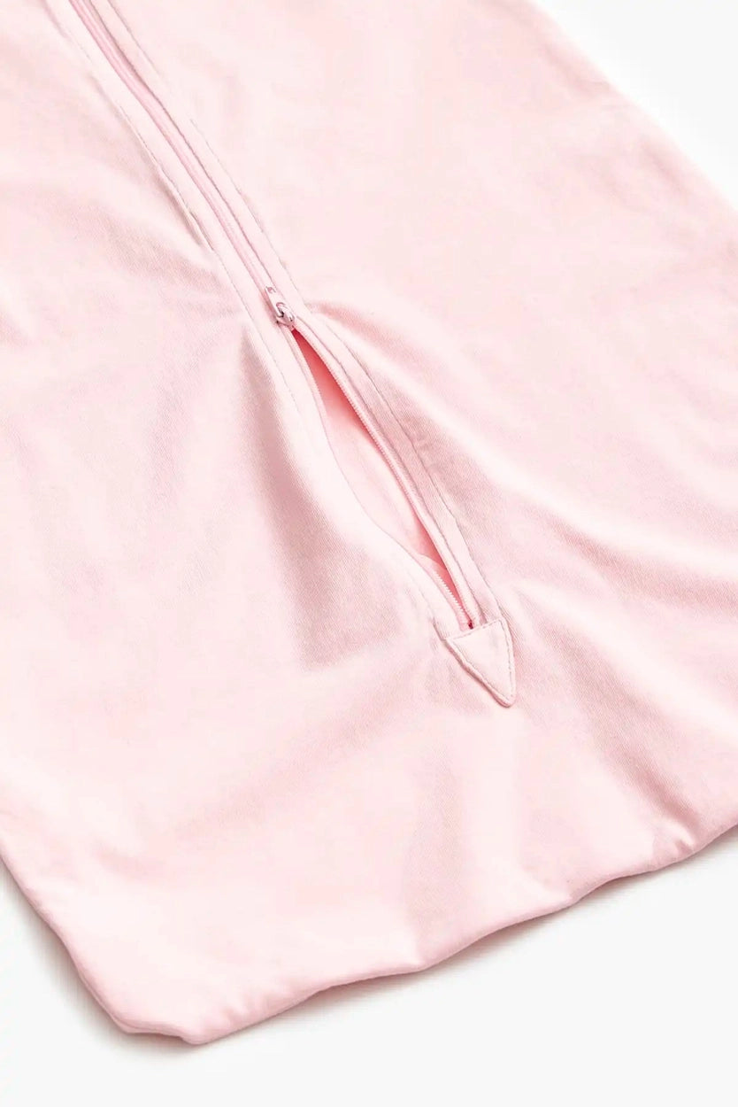 Baby sleep sack in solid pink featuring breathable organic cotton fabric