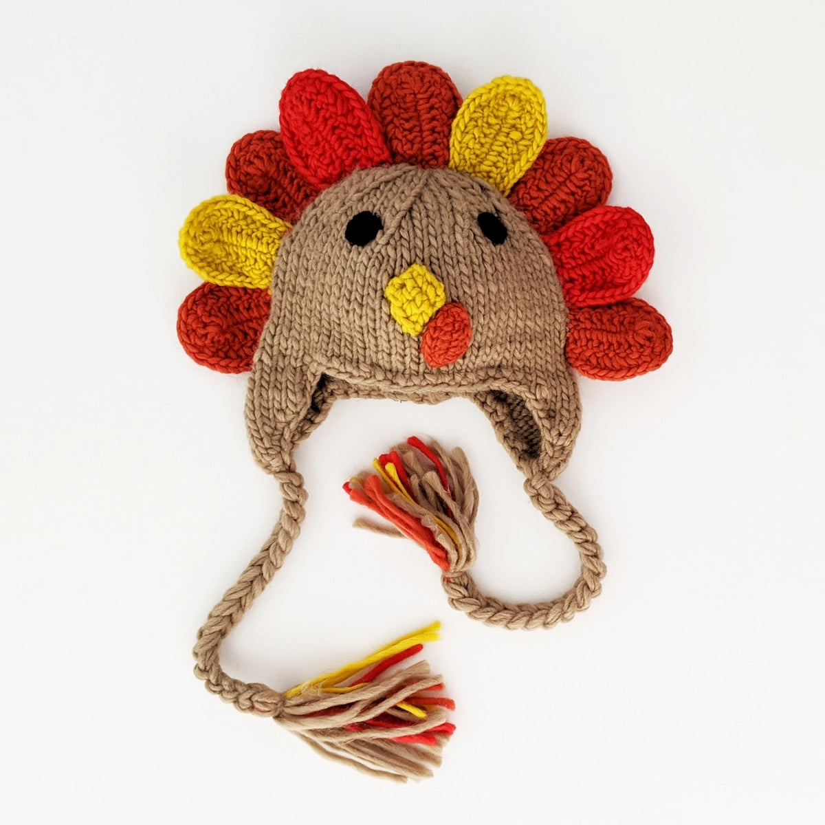 knit turkey baby hat with colorful red, orange, and yellow feathers, braided ear flap ties and turkey face