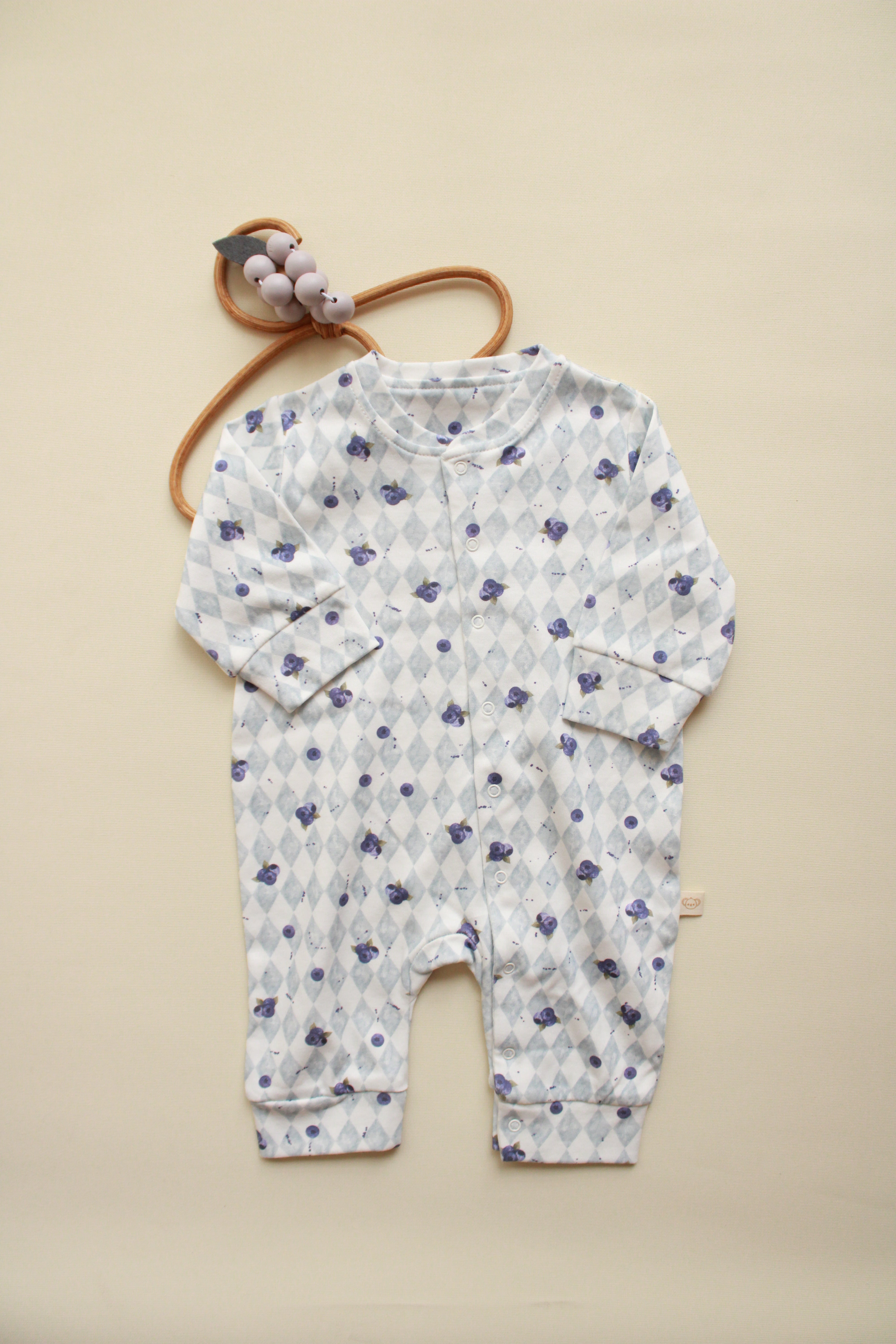 Blueberry print baby onesie with diamond knit pattern