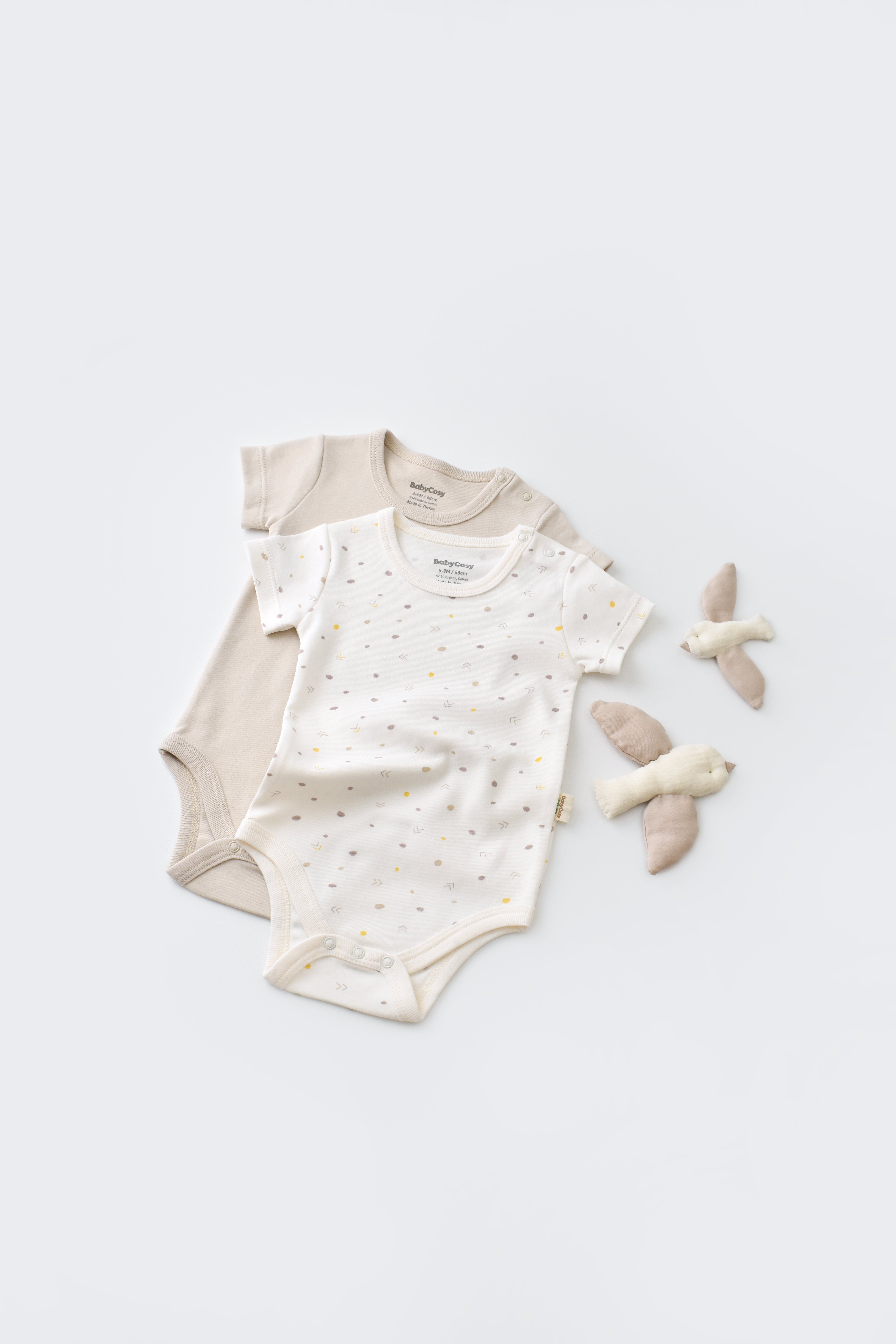 Short sleeve neutral cream bodysuit made in Turkey