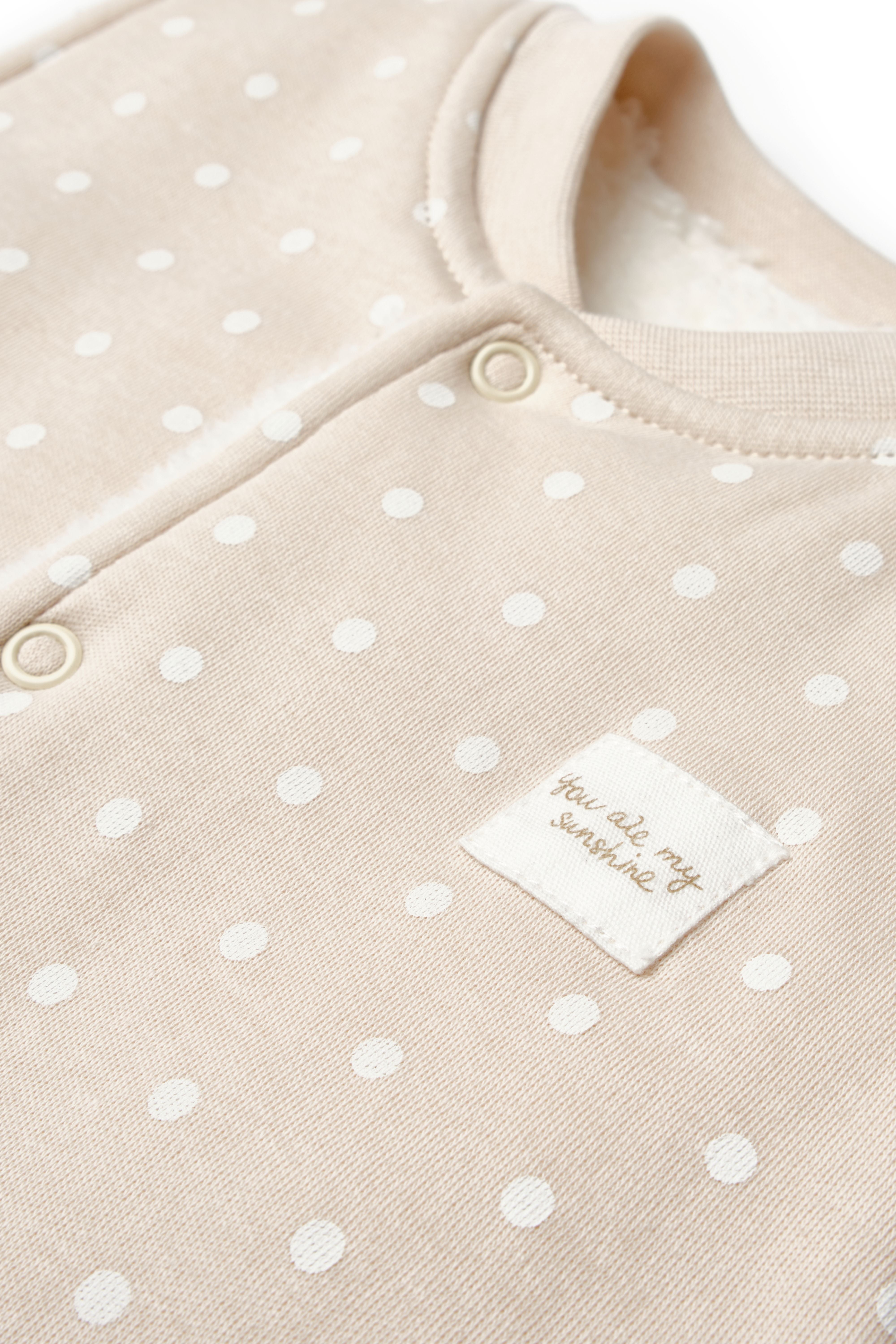 Warm organic infant vest with cozy sherpa interior