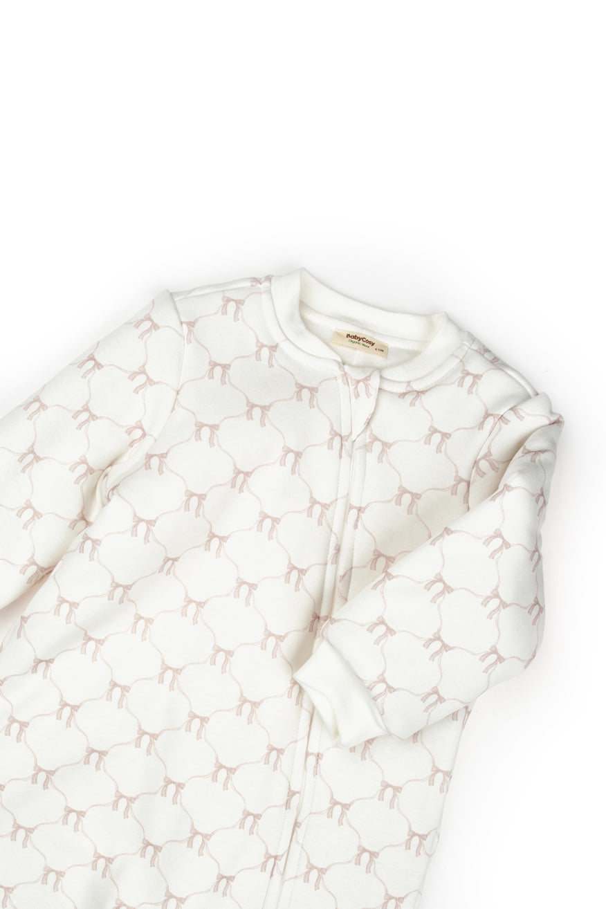 Long-sleeve zip-up romper with blush bow design