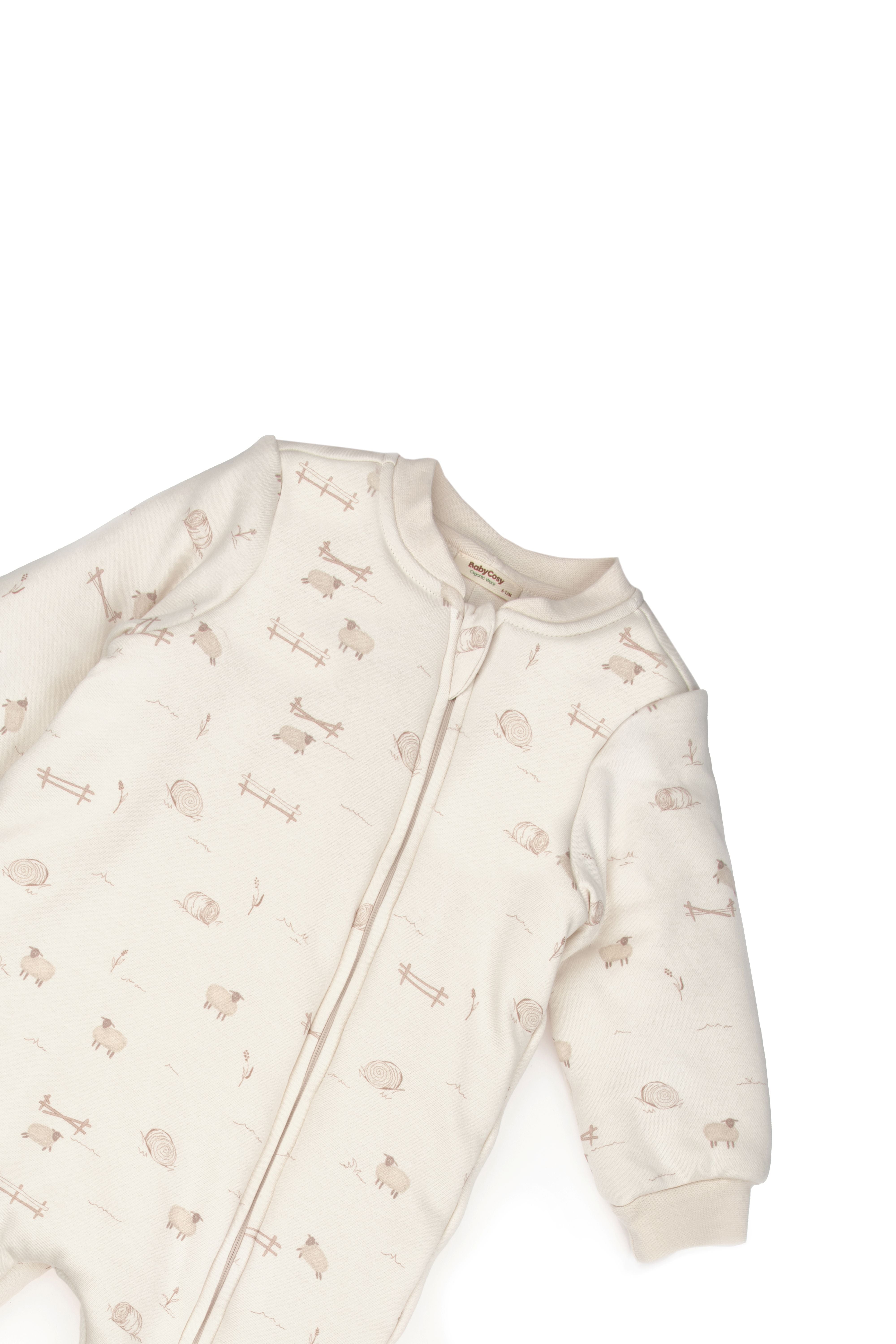 Zip-up baby romper in neutral tones with lamb illustrations