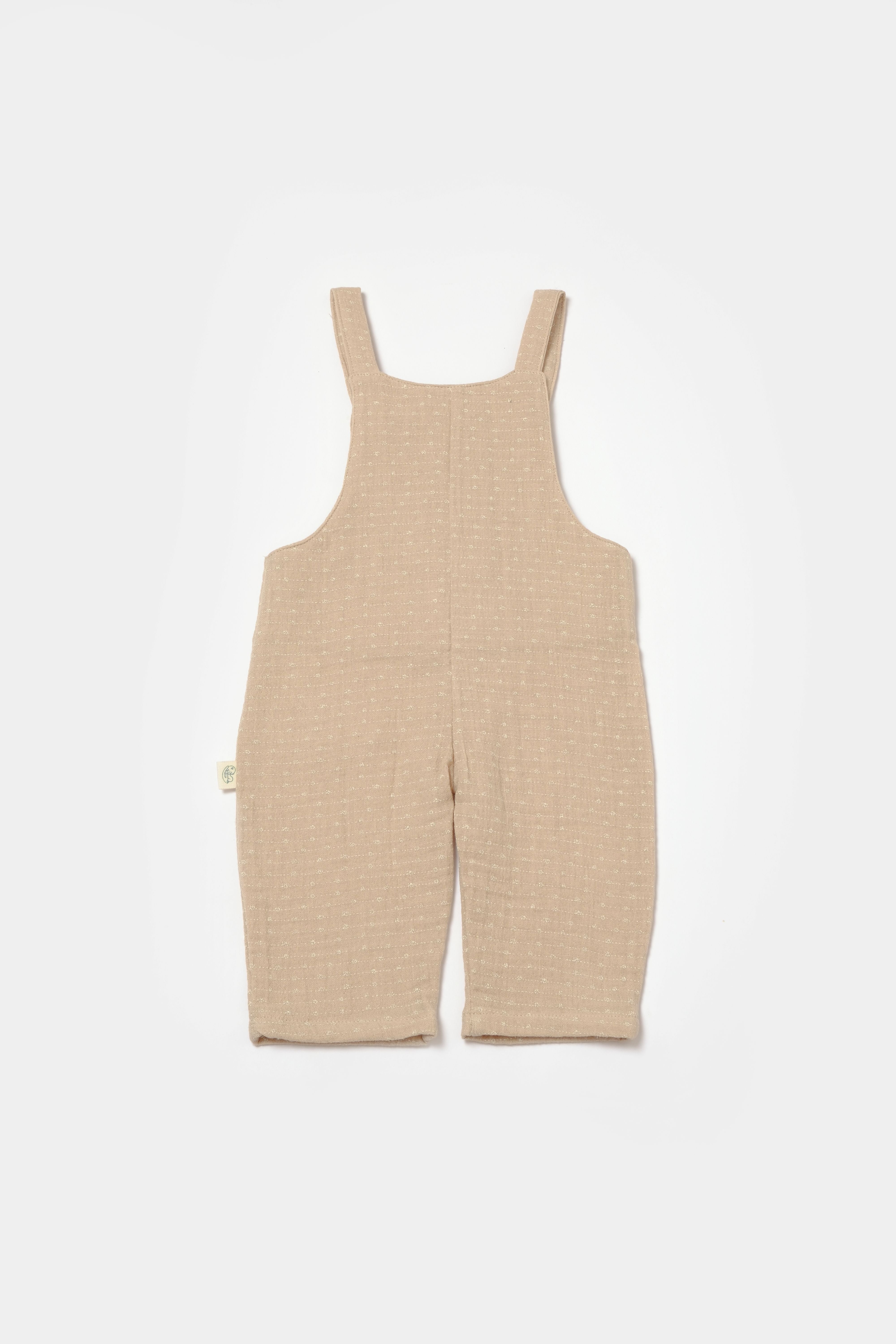 Soft beige baby romper with adjustable straps