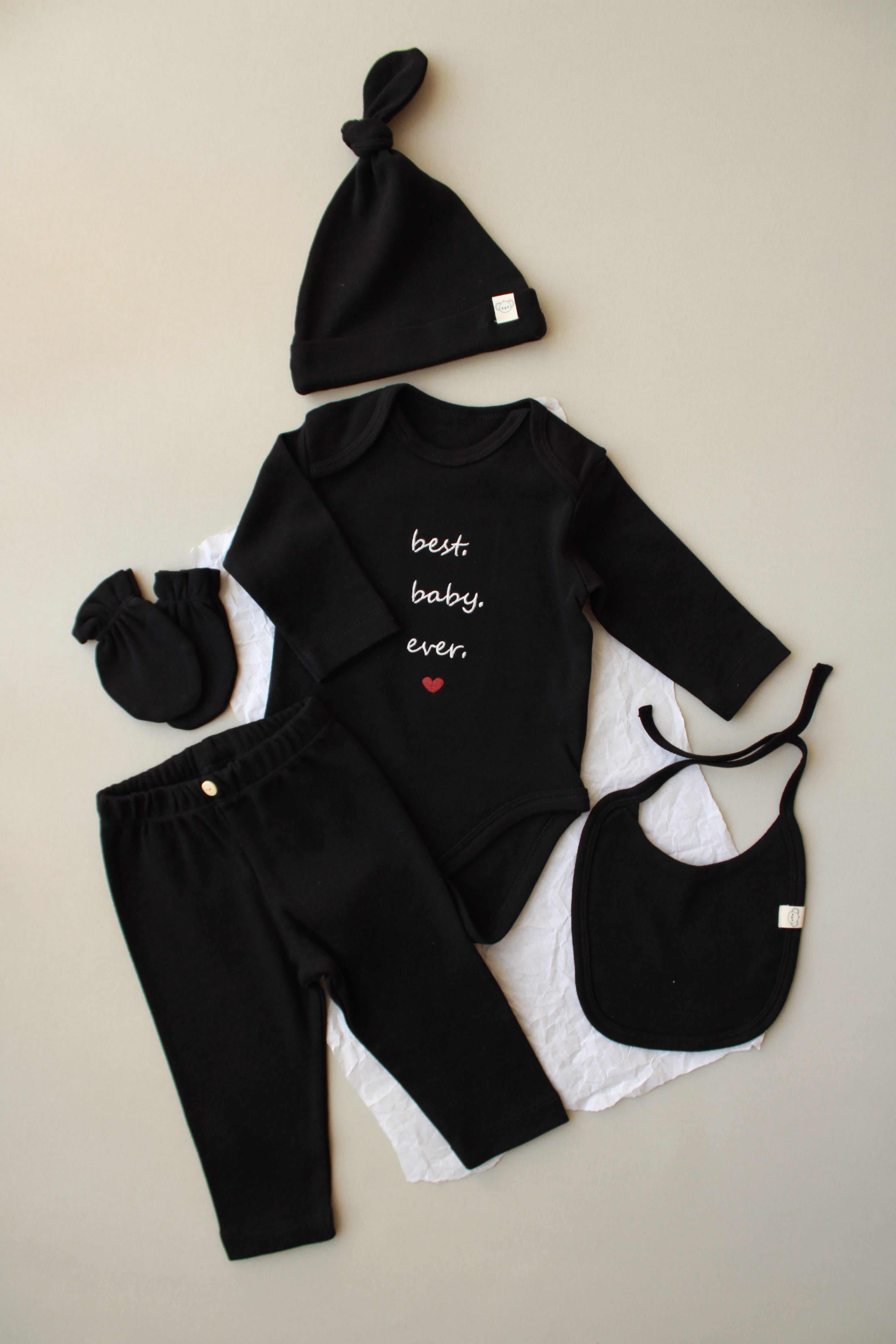 black newborn gift set with bodysuit pants hat mittens and bib