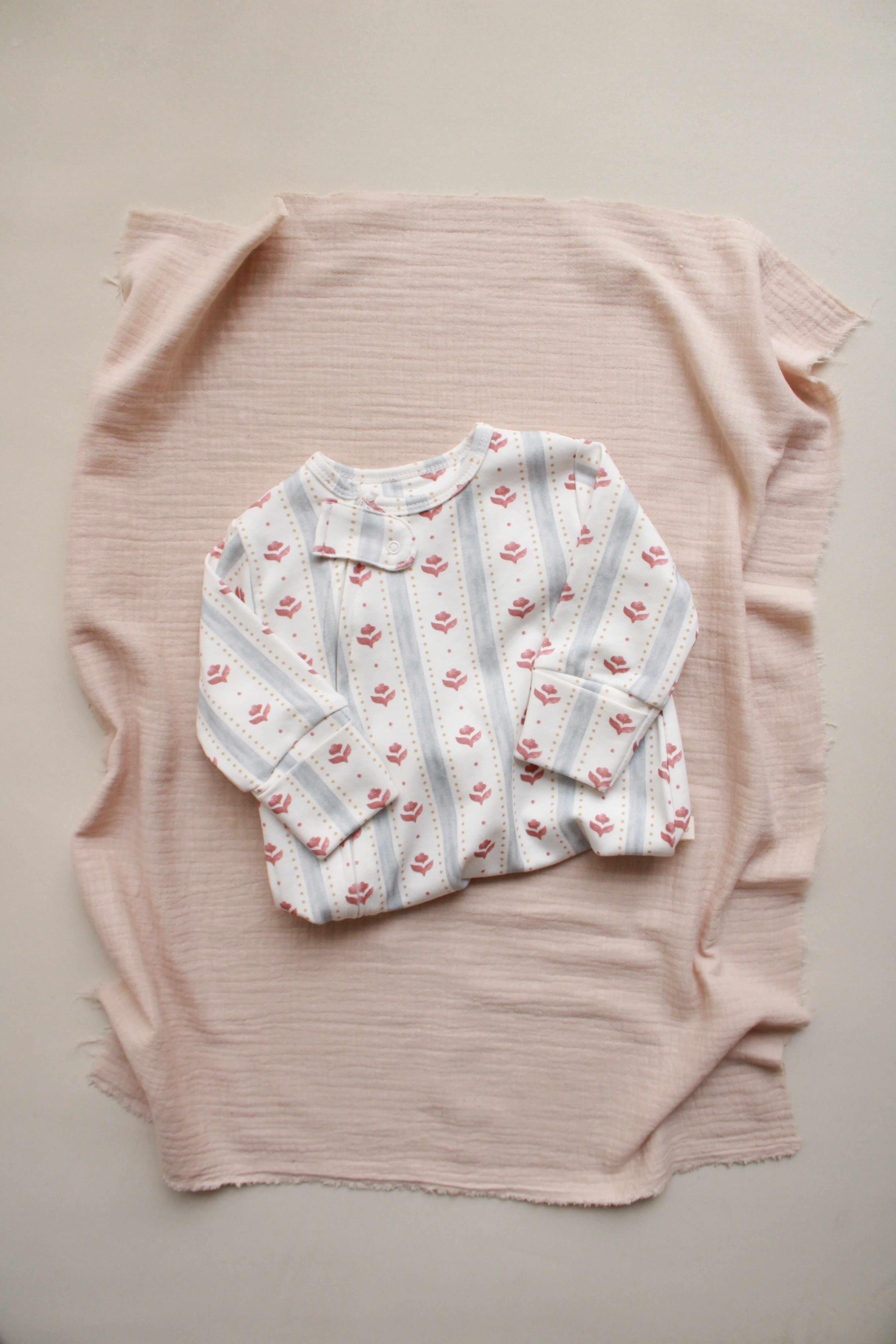 Soft long sleeve baby onesie with floral print
