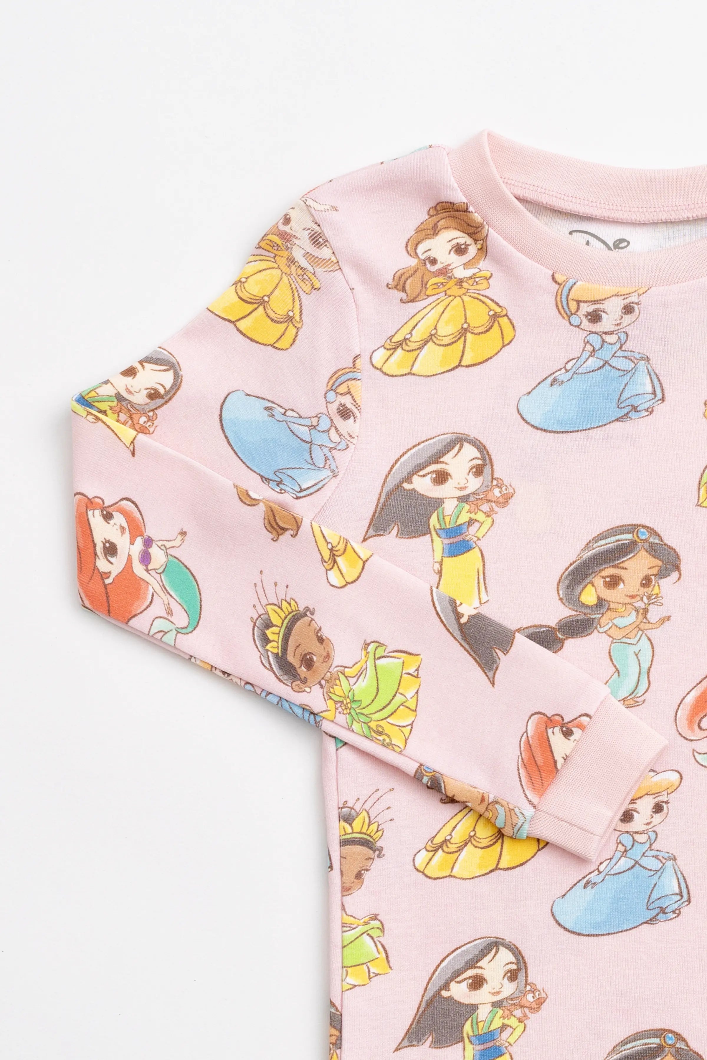 Girls wearing Disney Princess cotton pajamas with colorful princess print for bedtime.