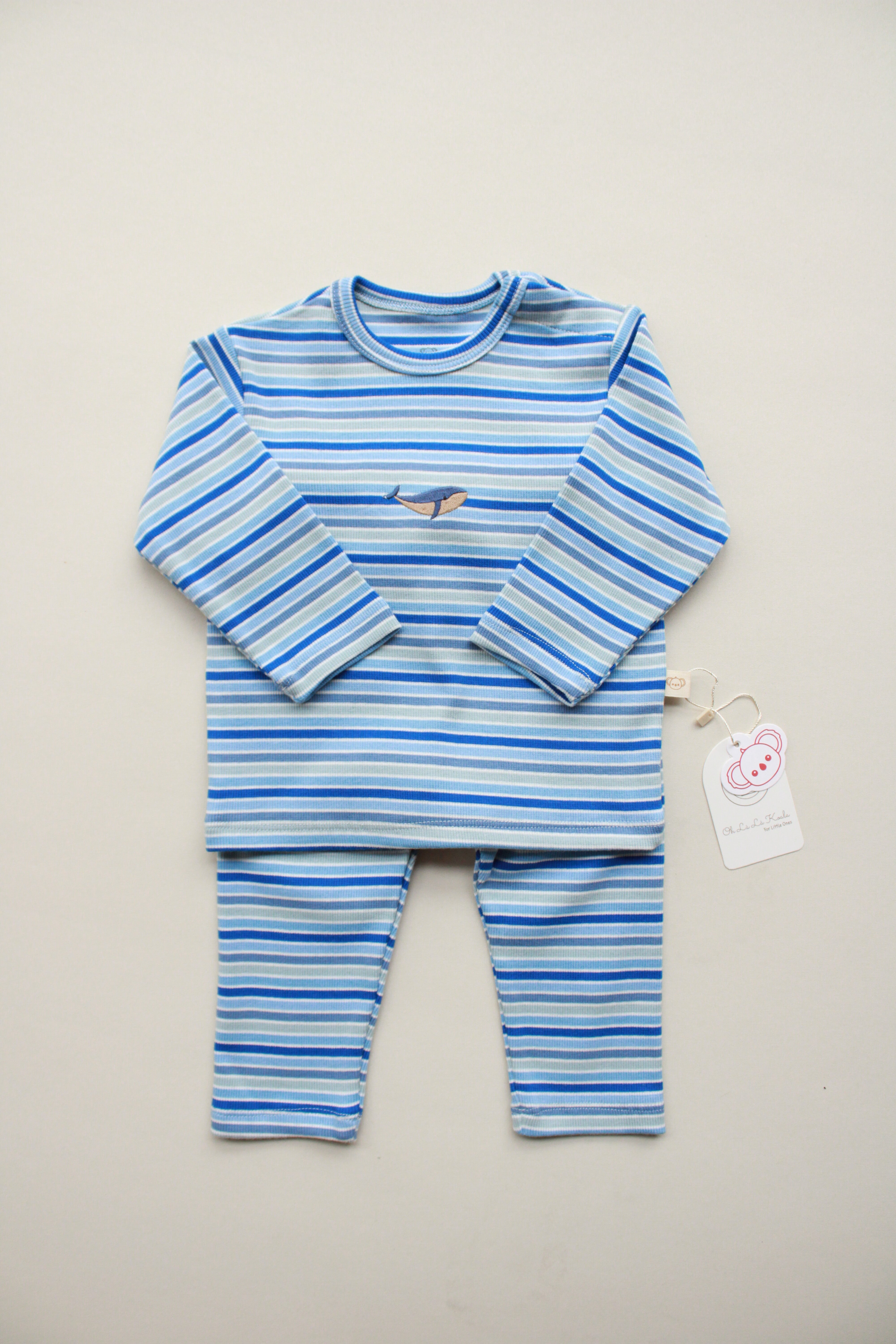 Blue and white striped baby outfit with whale embroidery.