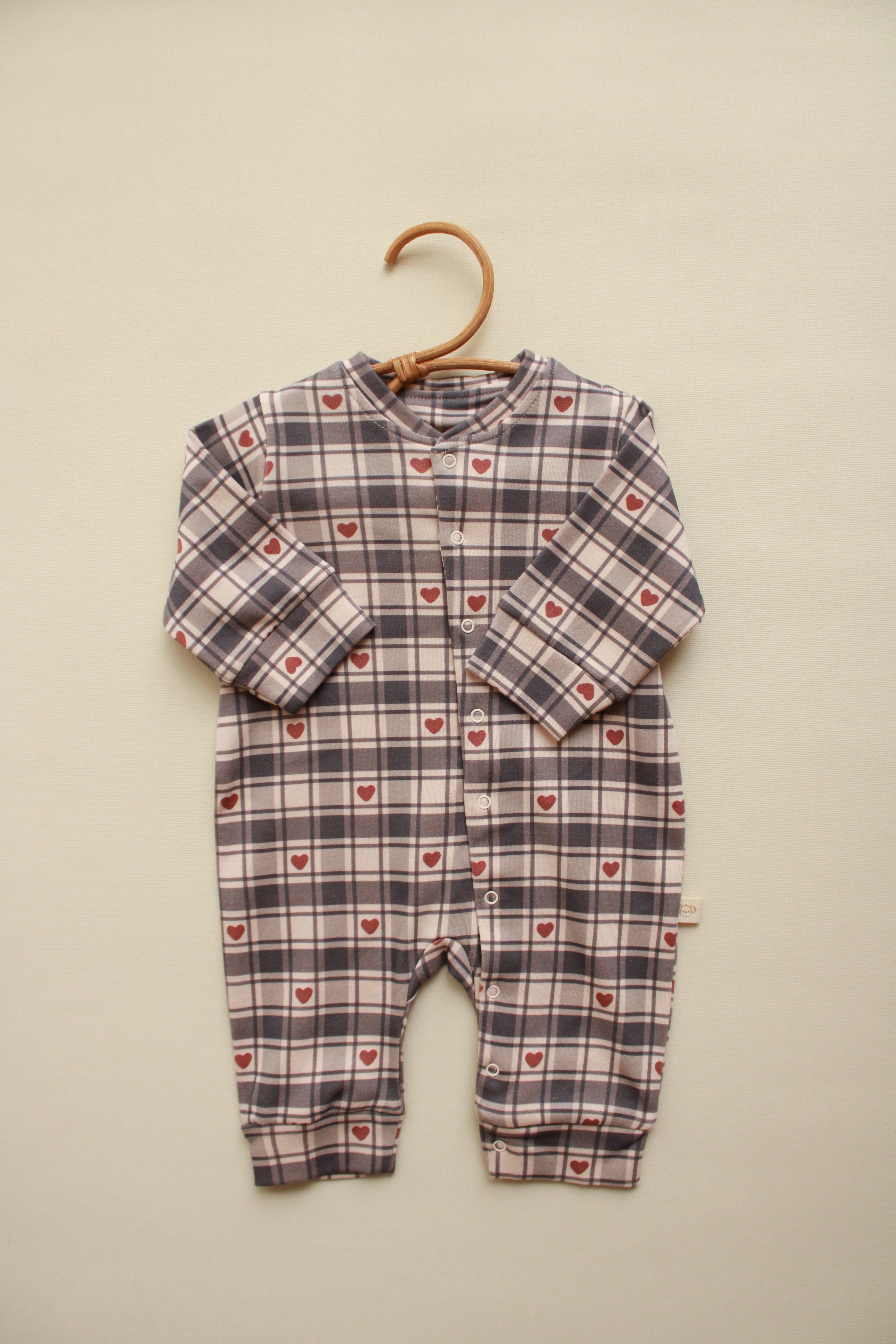 Heart plaid baby onesie with gray and white check pattern