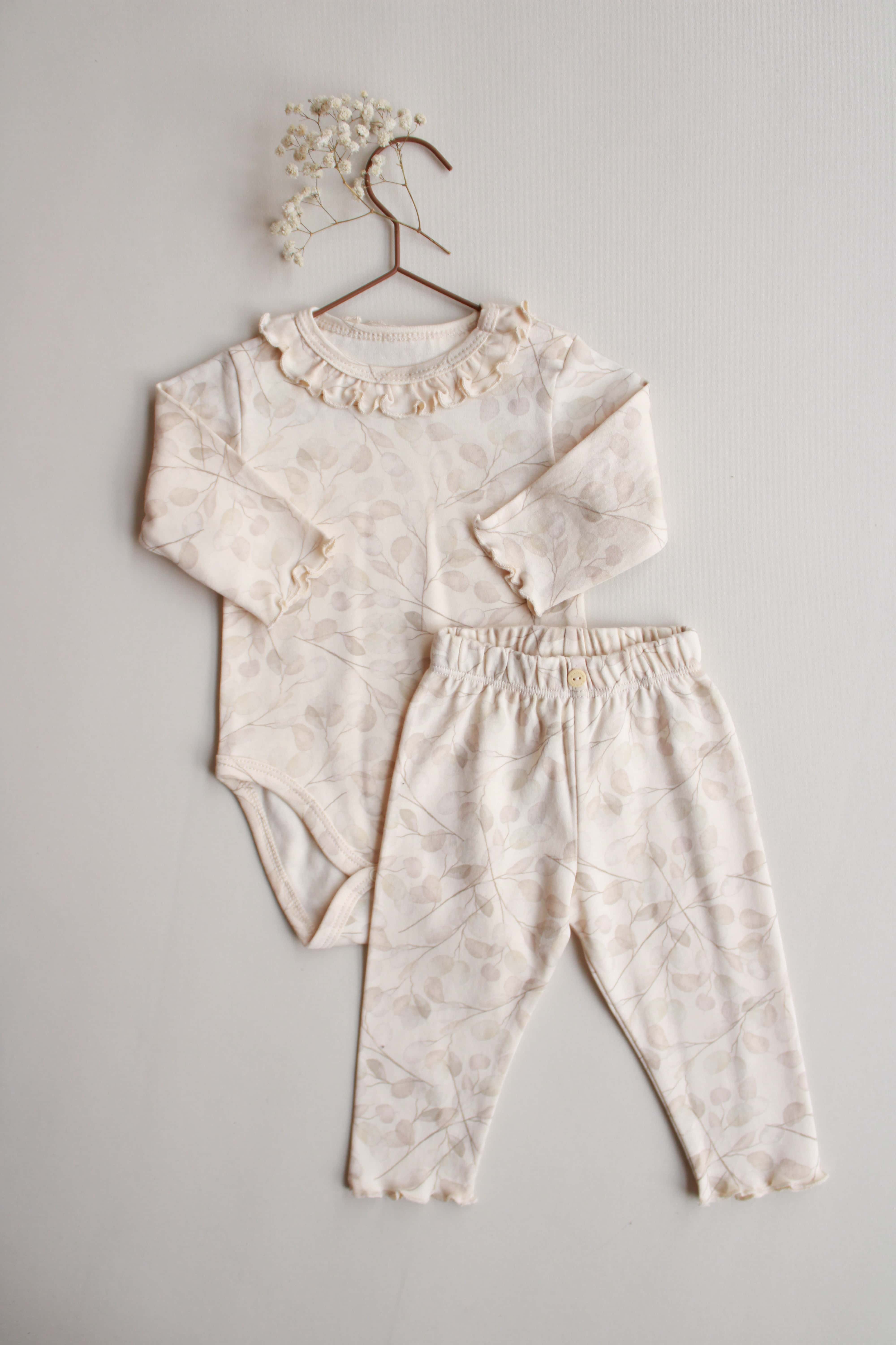 neutral floral baby set with ruffle neckline and matching pants