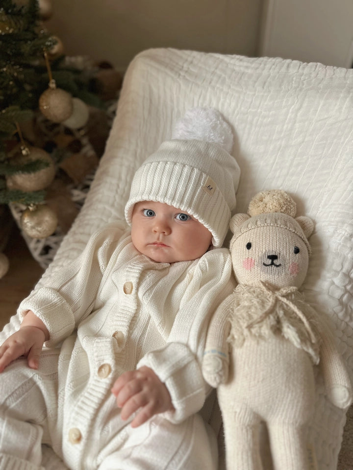 Unisex organic cotton baby romper in classic ribbed knit.