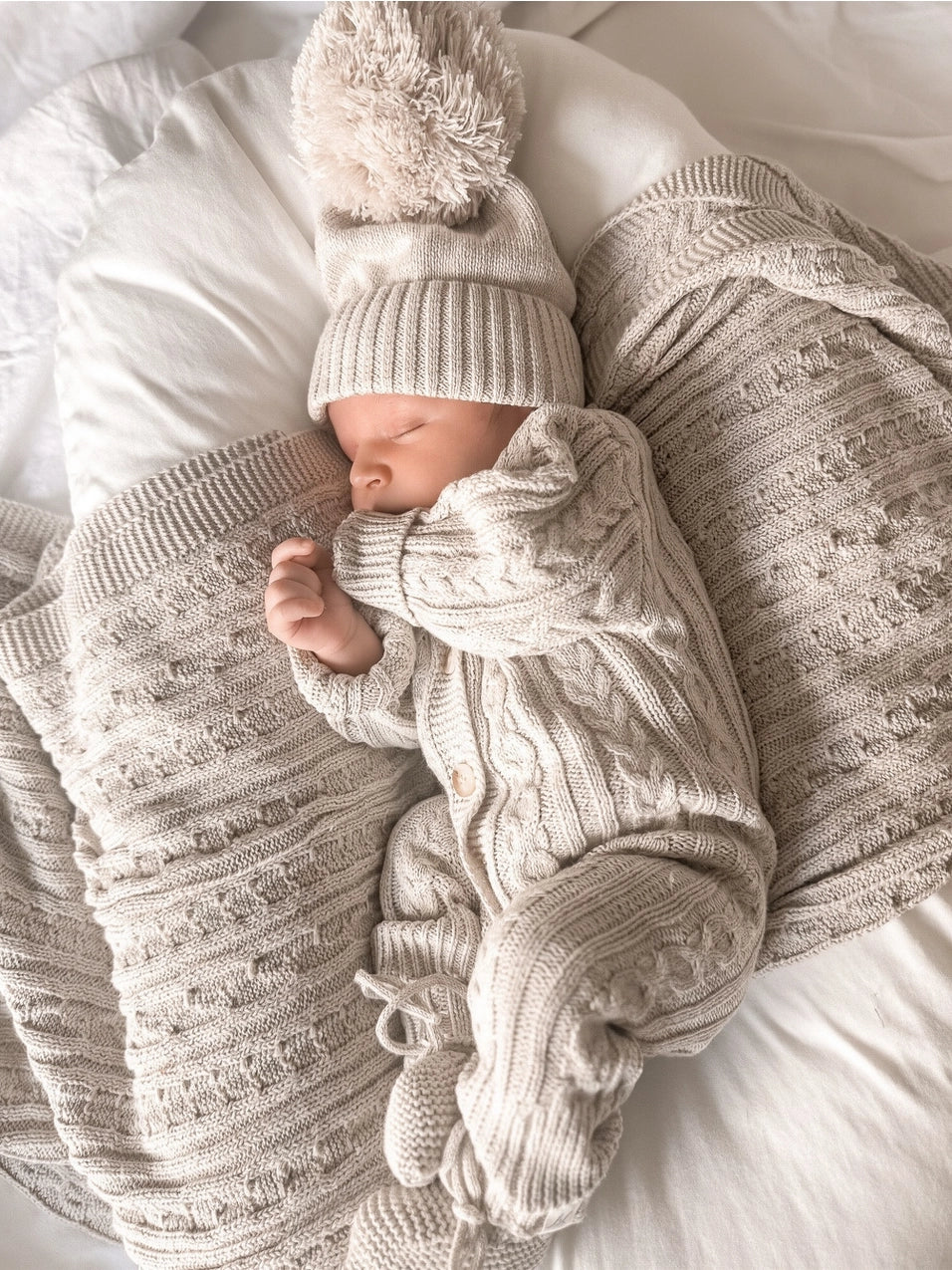 Cable knit baby romper