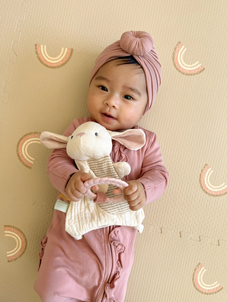 Soft neutral rabbit lovey with sensory ribbons
