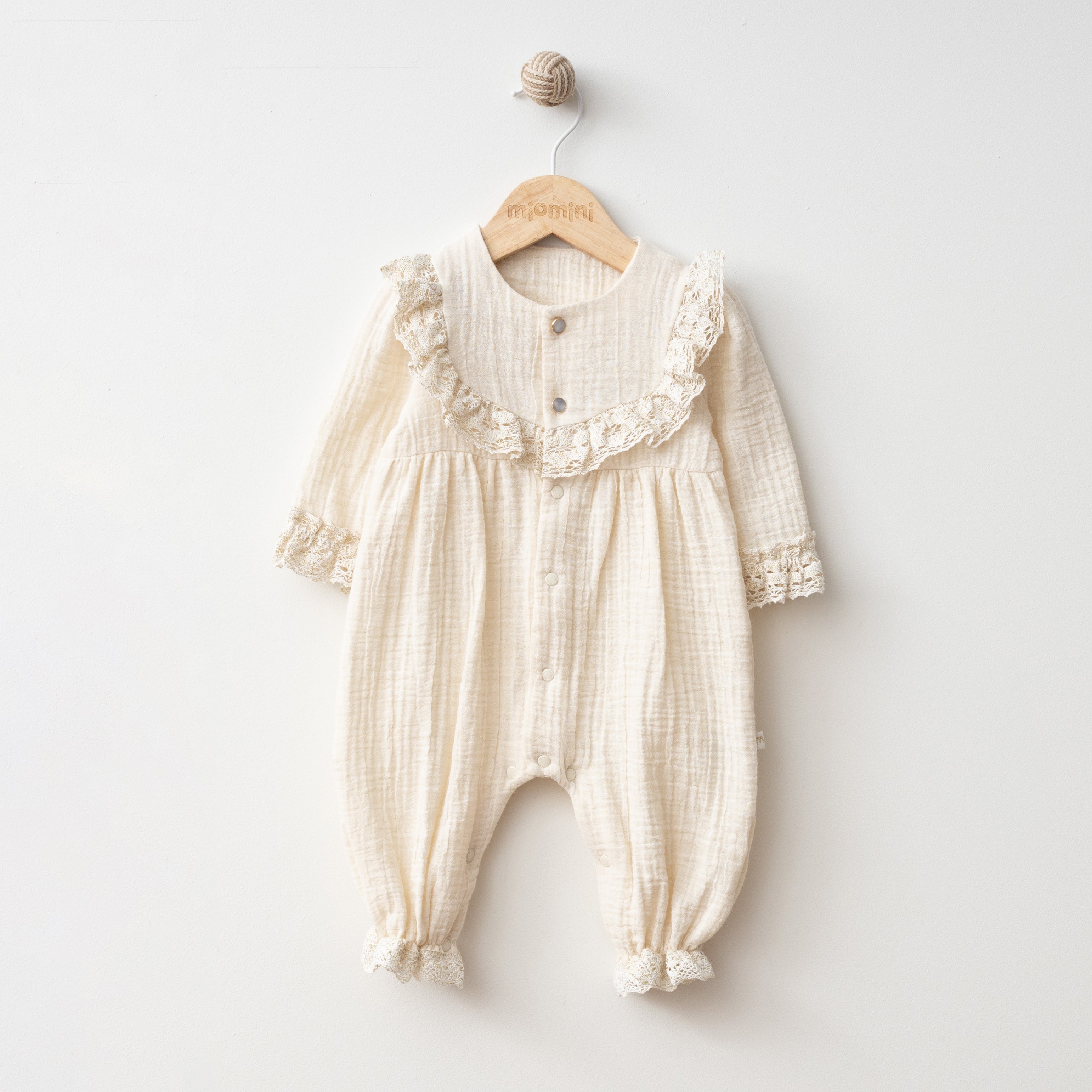 Emilia ruffle muslin baby romper, soft breathable cotton outfit for newborns and toddlers.