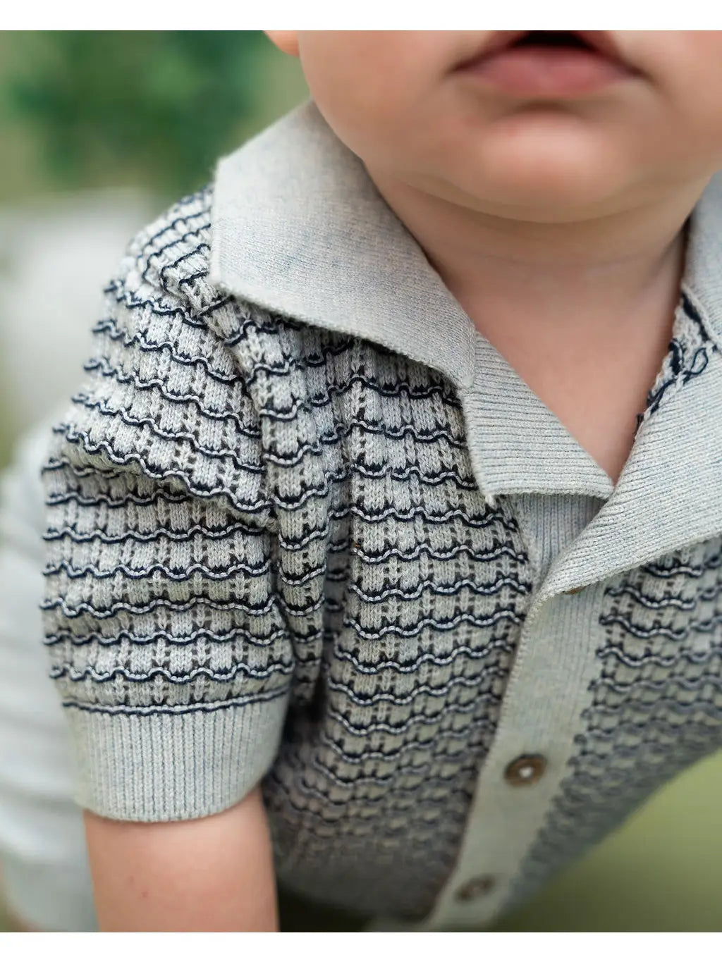 Soft organic baby summer outfit with breathable knit polo top and comfortable elastic waist shorts.
