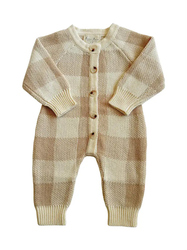 Organic cotton knit baby jumpsuit with a neutral checkered pattern.