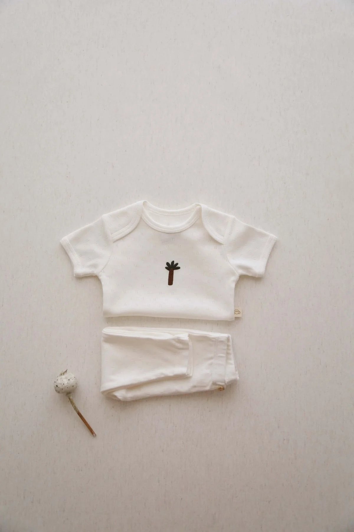 Palm tree patterned 2 piece baby clothing set, lightweight cotton outfit for summer infants and toddlers.